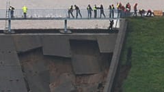 British military helping shore up damaged dam as risk of flooding of UK town rises 