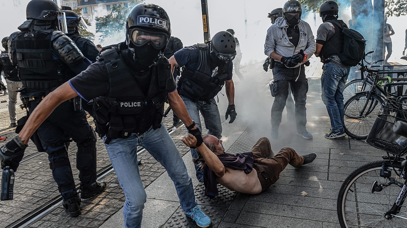 Anti-criminality brigade (BAC) police officers arrest a man during a gathering in Nantes