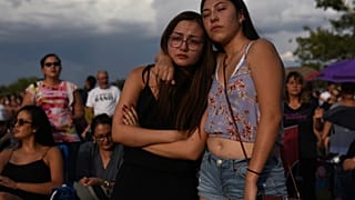 Amber Ruiz and Jazmyn Blake embrace during a vigil a day after a mass shooting at a Walmart store in El Paso, Texas, U.S. August 4, 2019. 
