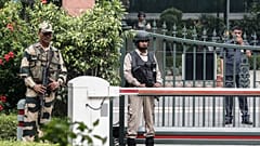Security personnel stand guard outside Indian Prime Minister Narendra Modi's house in New Delhi, India, August 5, 2019. 
