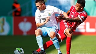 Bayern Munich’s Corentin Tolisso in action with Chemnitzer's Daniel Frahn (left)