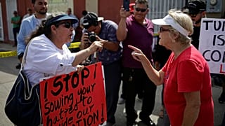 Protest and division at Trump visits mass shooting.scenes