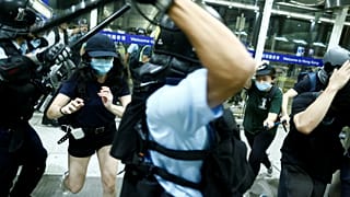 Police clash with protesters at Hong Kong International Airport