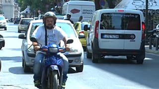 Ago Kouitimi driving through Athens