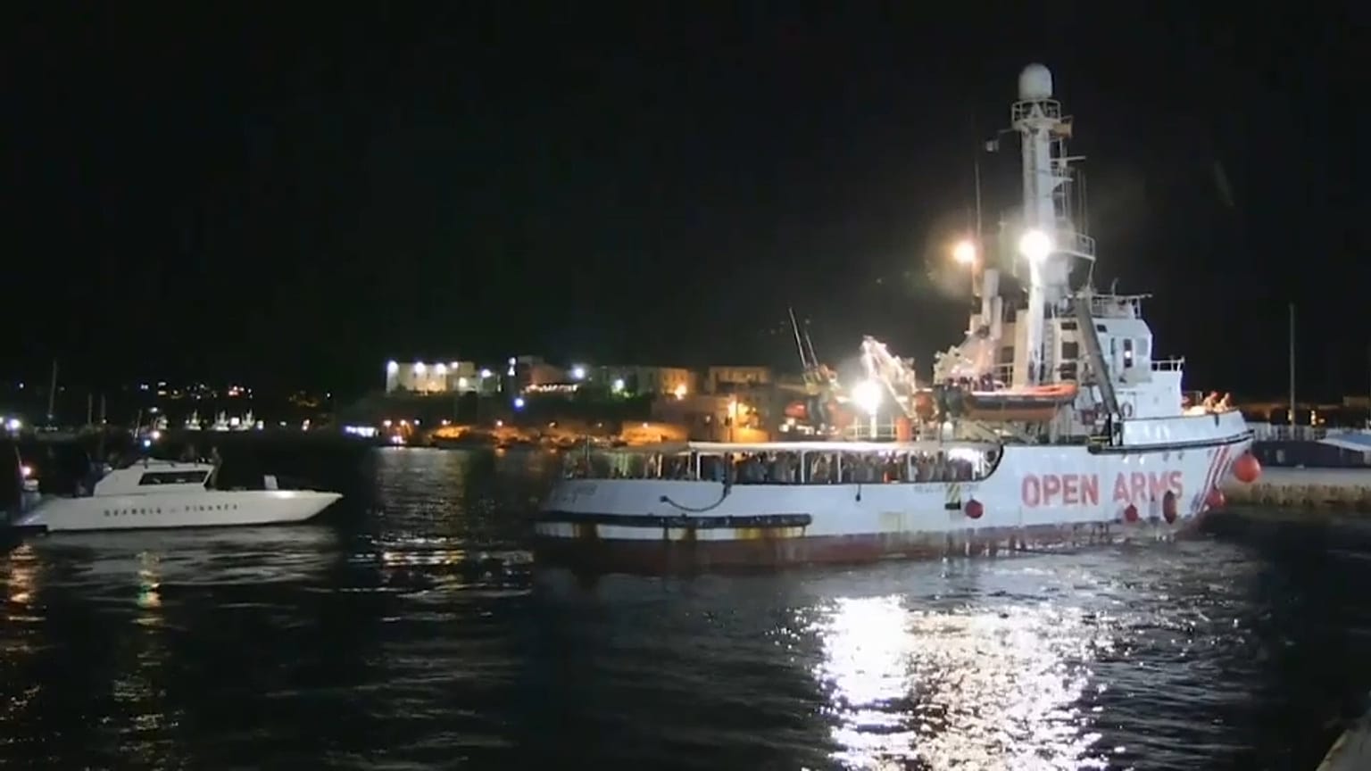 Migrants disembark in port of Lampedusa