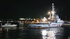 Migrants disembark in port of Lampedusa