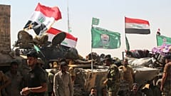 حشد شعبی: آمریکا مسئول اول و آخر حمله به انبارهای مهمات ما است