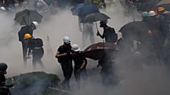 Anti-extradition bill protesters are surrounded by tear gas during clashes with police in Tsuen Wan in Hong Kong, China August 25, 2019. Picture taken August 25, 2019.