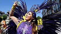 Notting Hill Carnival parade performer in the heat