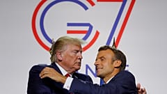 French President Emmanuel Macron greets U.S. President Donald Trump after a joint press conference at the end of the G7 summit in Biarritz, France, August 26, 2019. 