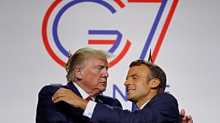 French President Emmanuel Macron greets U.S. President Donald Trump after a joint press conference at the end of the G7 summit in Biarritz, France, August 26, 2019.