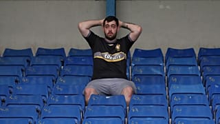 Bury fan, at their ground Gigg lane, after finding out their takeover deal fell through