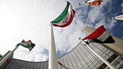 The Iranian flag flutters in front the International Atomic Energy Agency headquarters in Vienna