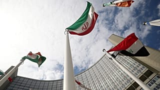 The Iranian flag flutters in front the International Atomic Energy Agency headquarters in Vienna