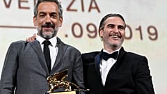 Director Todd Phillips poses next to Joaquin Phoenix after winning the Golden Lion for Best Film in Venice, Italy on September 7, 2019.
