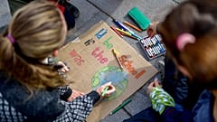 Young activists paint placards during the Fridays for Future global climate strike in Stockholm, Sweden, September 20, 2019.