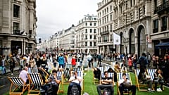 People relax on deck chairs on Regent Street after it was shut as part of 'Car Free Day' in London, Britain, September 22, 2019. 
