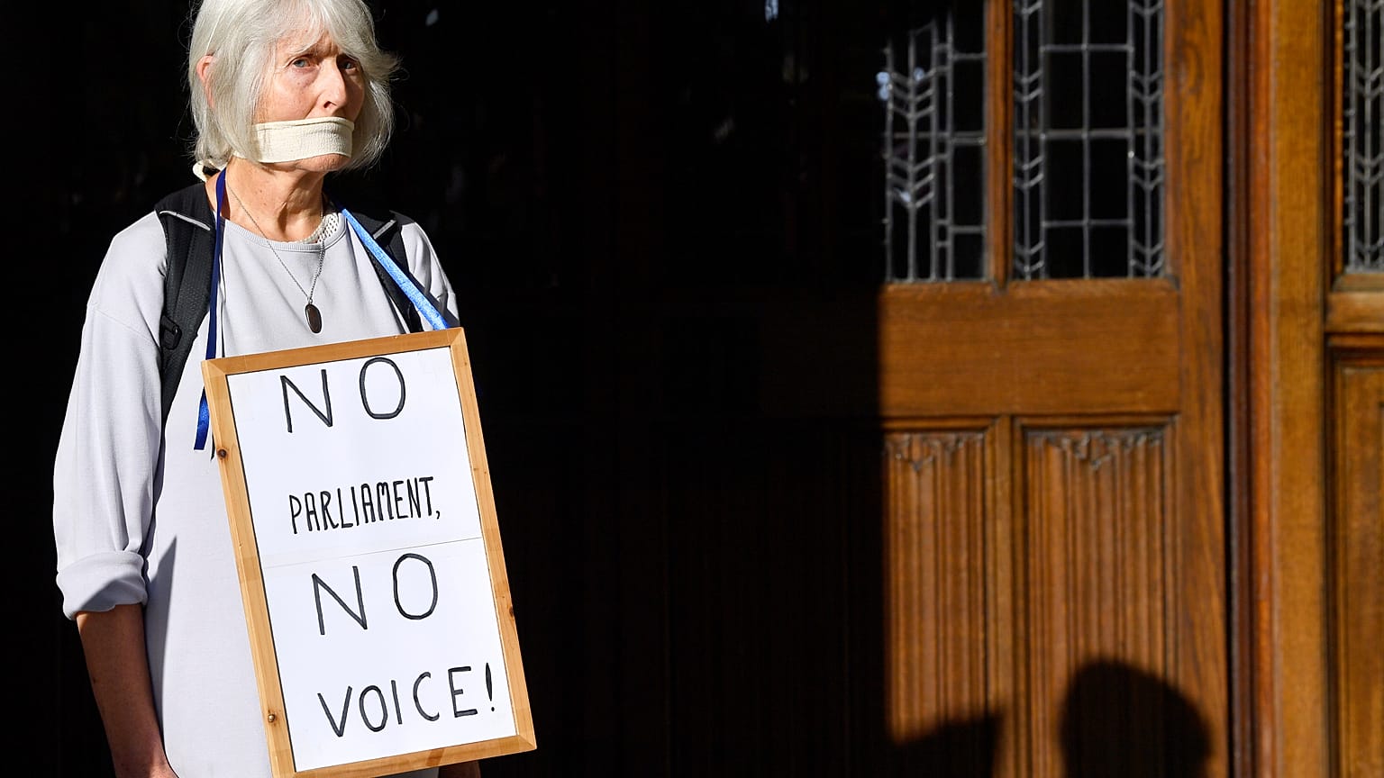 A woman protests outside the Supreme Court of the United Kingdom against Prime Minister Boris Johnson's decision to prorogue parliament, in London, Britain September 17, 2019.