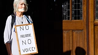 A woman protests outside the Supreme Court of the United Kingdom against Prime Minister Boris Johnson's decision to prorogue parliament, in London, Britain September 17, 2019.