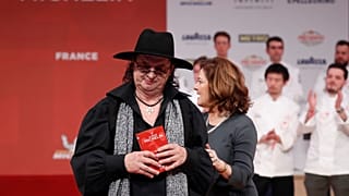 FILE PHOTO: French chef Marc Veyrat reacts after he was awarded with three Michelin stars for his restaurant La Maison des Bois in Manigod, February 5, 2018. 