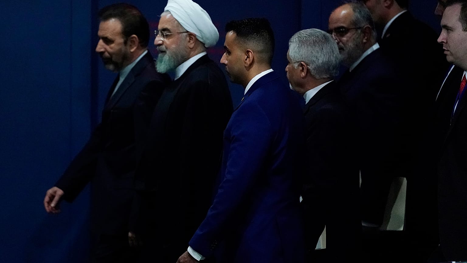 Iran's Hassan Rouhani walks with his entourage through the General Assembly Hall during the 74th session of the United Nations General Assembly at U.N. headquarters i