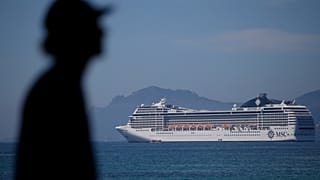 A cruise shipped docked in the bat at Cannes, France