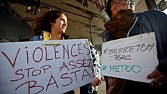 FILE PHOTO: Women hold placards reading, "Violence. Stop. Enough!" and #BalanceTonPorc - or 'expose your pig', during a gathering against gender-based  violence, France, 2017