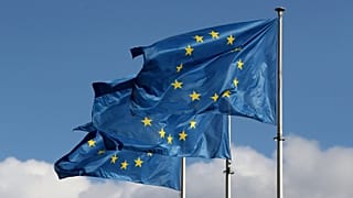 European Union flags fly outside the EU Commission headquarters in Brussels, Belgium