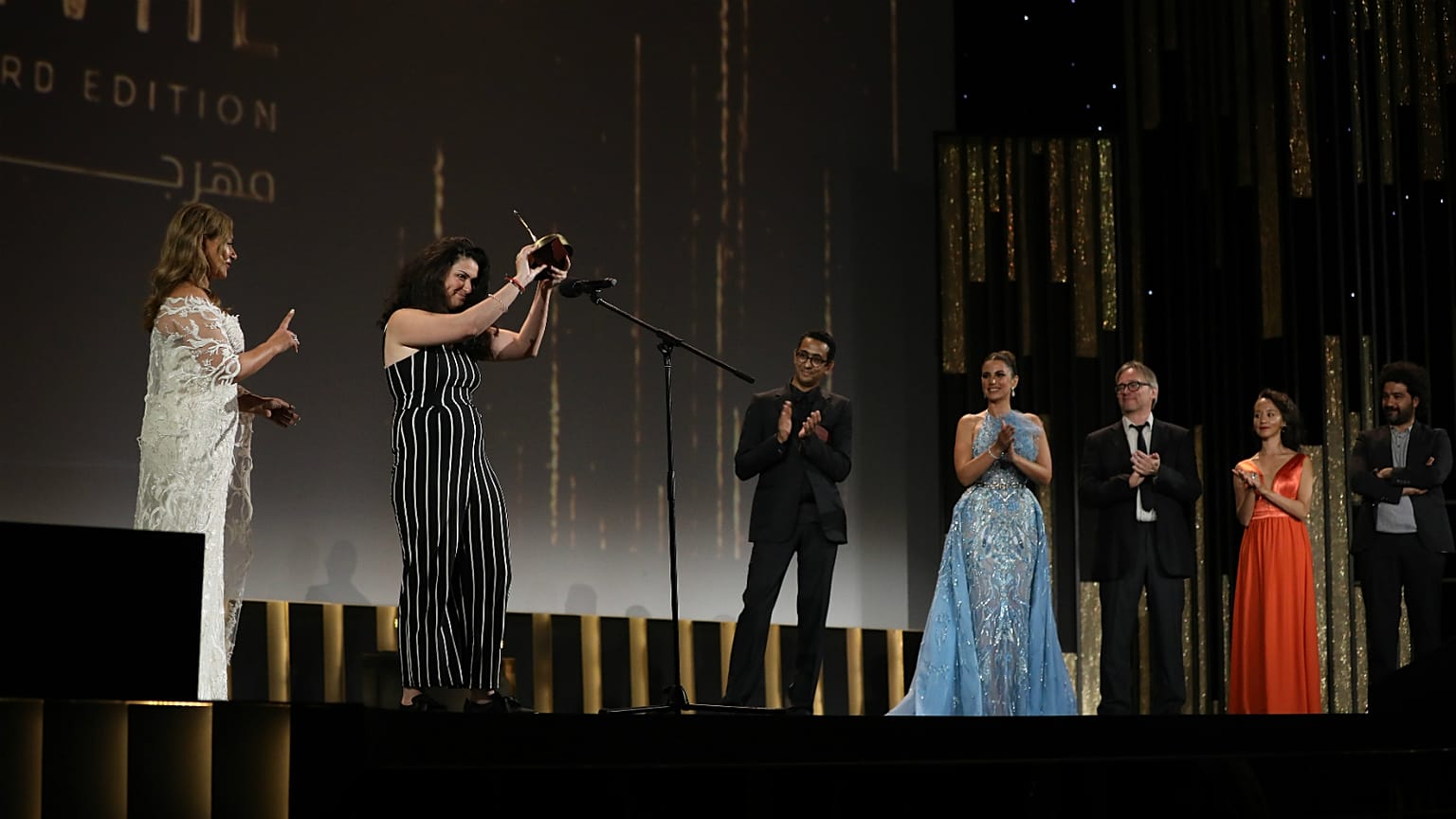 Zain Duraie receives the award for Best Arab Short Film for Give Up The Ghost
