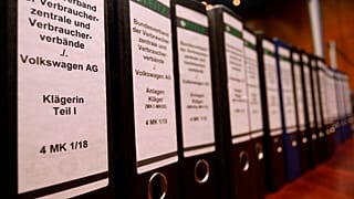 Folders pictured before the start of a hearing in a class action suit filed by over 400,000 of diesel automobile owners against VW in Brunswick, September 30, 2019