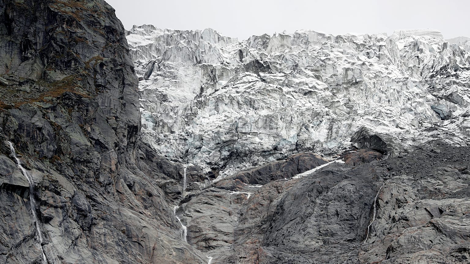 A segment of the Planpincieux glacier is reflected in water on the Italian side of the Mont Blanc massif area of Planpincieux, Aosta, Italy, September 27, 2019. 