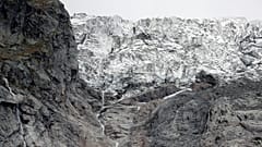 A segment of the Planpincieux glacier is reflected in water on the Italian side of the Mont Blanc massif area of Planpincieux, Aosta, Italy, September 27, 2019. 