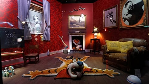 Original artworks by British artist Banksy form part of an installation inside a shop front, ahead of an online sale, in Croydon, Britain