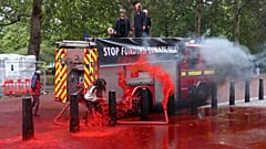Extinction Rebellion: Climate activists fire hundreds of gallons of fake blood at the UK's Treasury