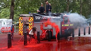 Extinction Rebellion: Climate activists fire hundreds of gallons of fake blood at the UK's Treasury