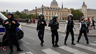 French police secure the area in front of the Paris Police headquarters in Paris