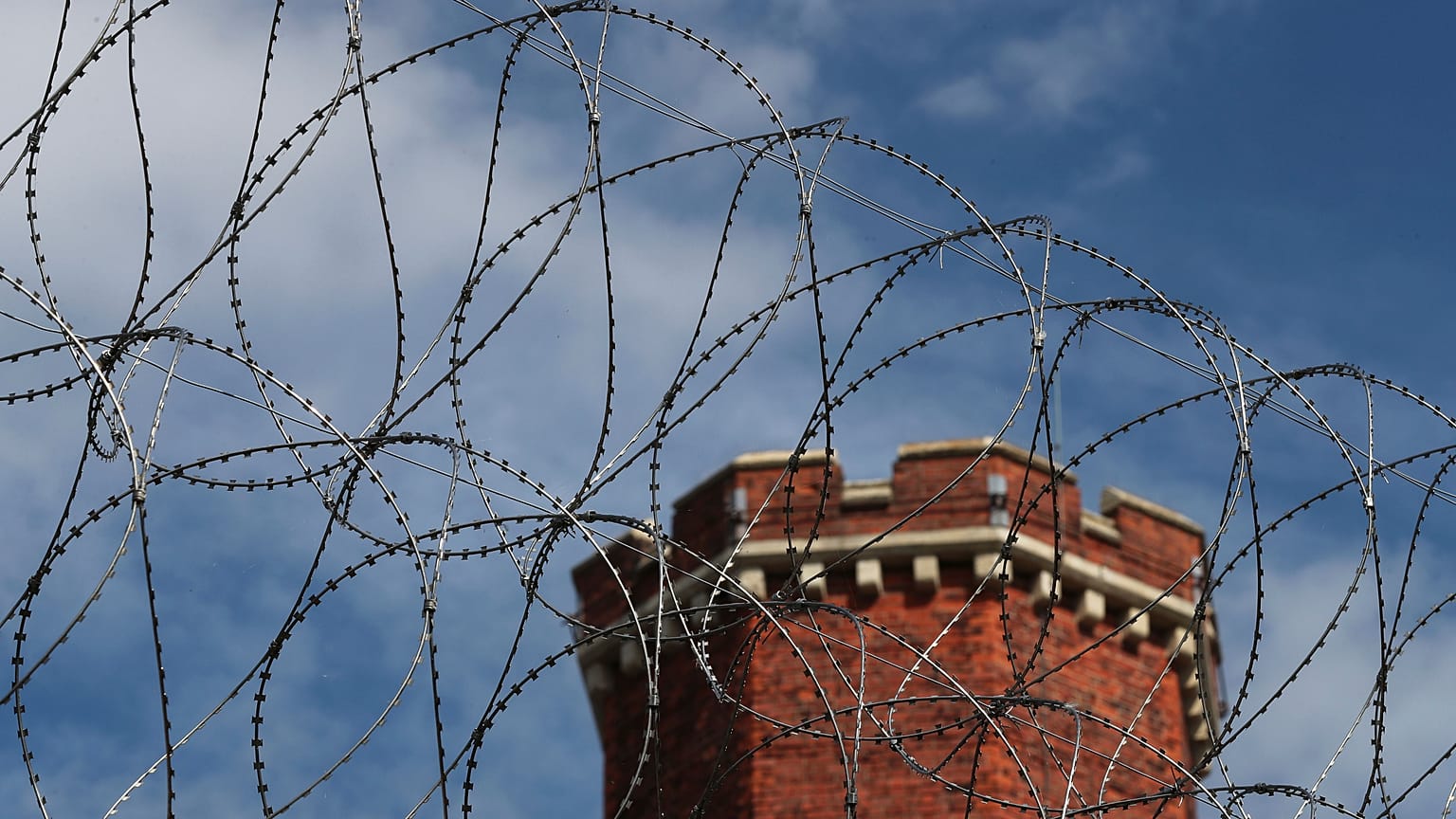 A general view shows razor wire surrounding the former Reading prison where Oscar Wilde was gaoled for gross indecency with another man, in Reading, Britain September 1, 2016.