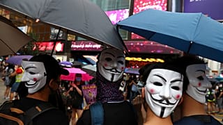 Thousands defy anti-mask law at Hong Kong march