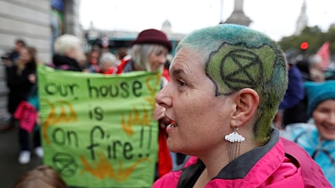 Extinction Rebellion activists glue hands to ground  in central London