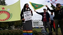 People rally to protest U.S. President Donald Trump's decision to withdraw U.S. troops from northeastern Syria in front of the White House