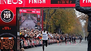 enya's Eliud Kipchoge, the marathon world record holder, crosses the finish line during his attempt to run a marathon in under two hours in Vienna, Austria, October 12, 2019.