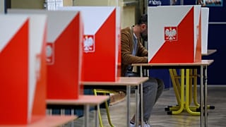 A man attends a voting during parliamentary election at a polling station in Warsaw, Poland, October 13, 2019.