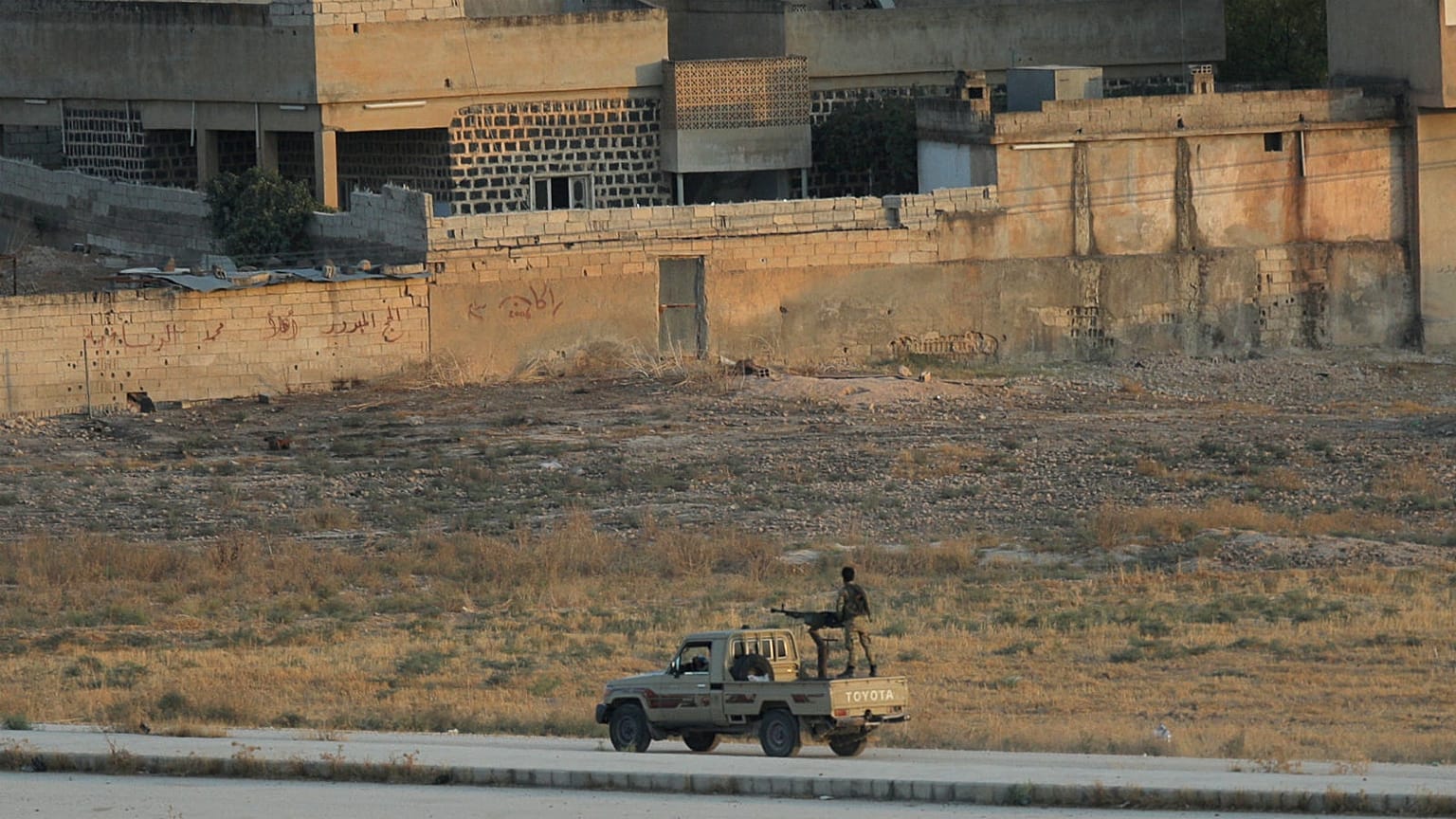 Turkish-backed Syrian rebels are seen in the Syrian border town of Tel Abyad, as seen from Akcakale, Turkey, October 13, 2019.