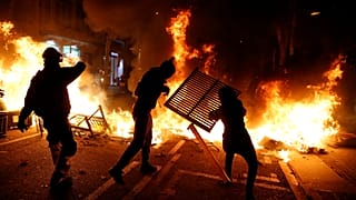 At least four detained as police clash with Catalan separatist supporters in Barcelona