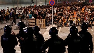 How do the protests in Barcelona compare with those in Hong Kong?