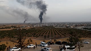 Smoke rises over the Syrian town of Ras al Ain, as seen from the Turkish border town of Ceylanpinar, in Sanliurfa province, Turkey, October 16, 2019.