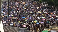 Hong Kong police and protesters exchange tear gas and petrol bombs