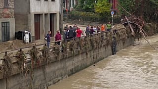 Local residents clean up after flash floods in Castelletto D'Orba