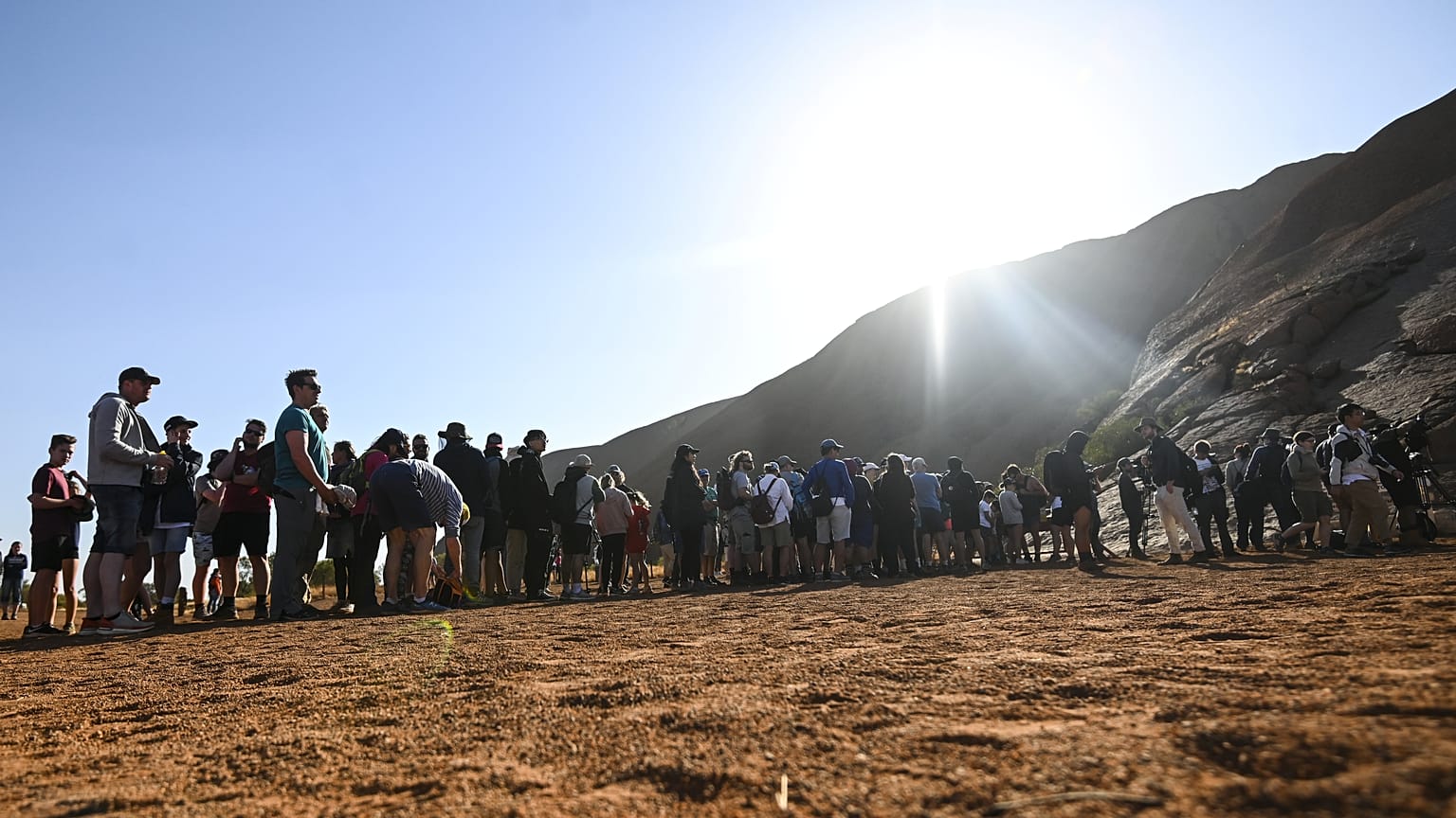 Tourists are seen climbing Uluru, formerly known as Ayers Rock, at Uluru-Kata Tjuta National Park in the Northern Territory, Australia, October 25, 2019. 