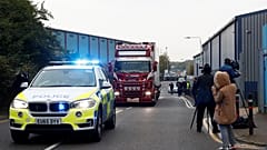 The scene where bodies were discovered in a lorry container, in Grays, Essex